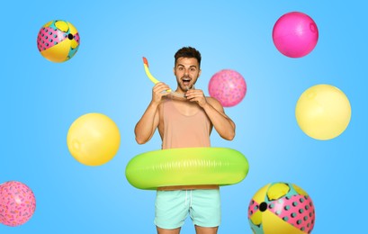 Happy man with inflatable ring among falling beach balls on light blue background. Summer vibe