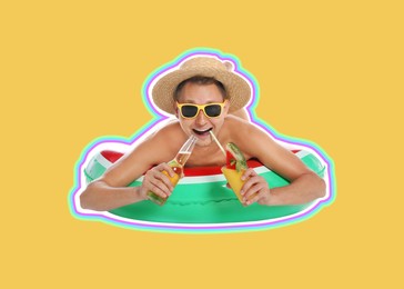 Happy man with inflatable ring, cocktail and beer on golden background. Summer vibe