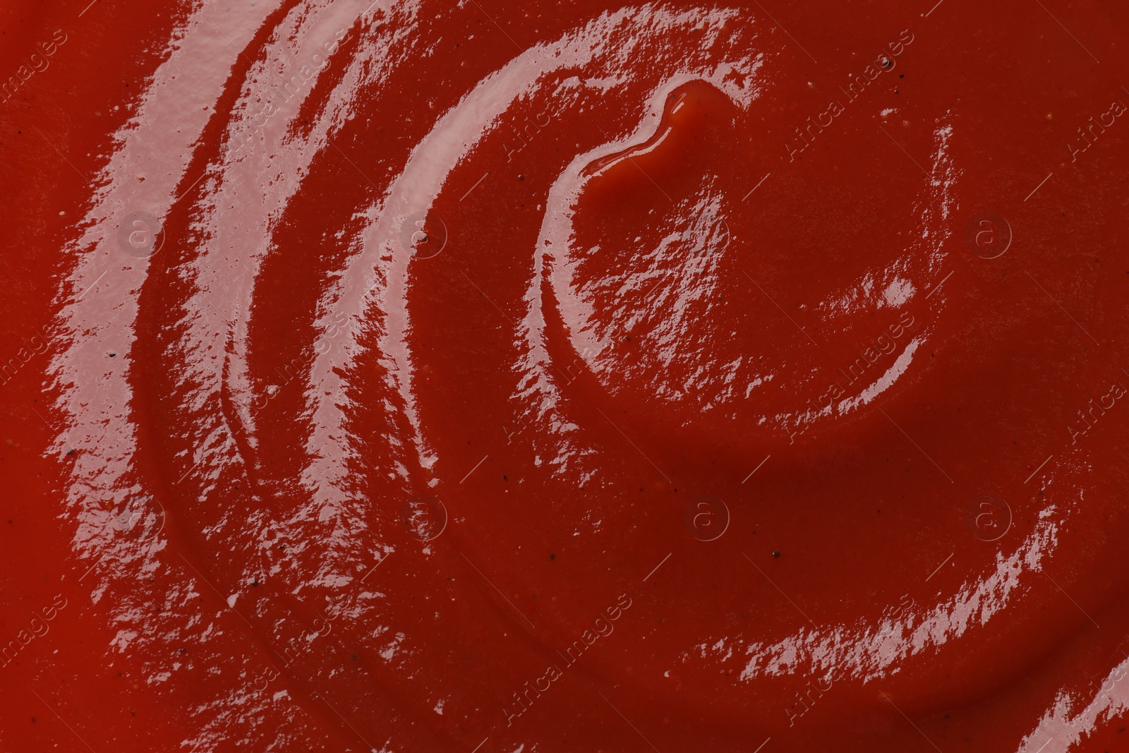 Photo of Texture of tasty ketchup as background, top view. Tomato sauce