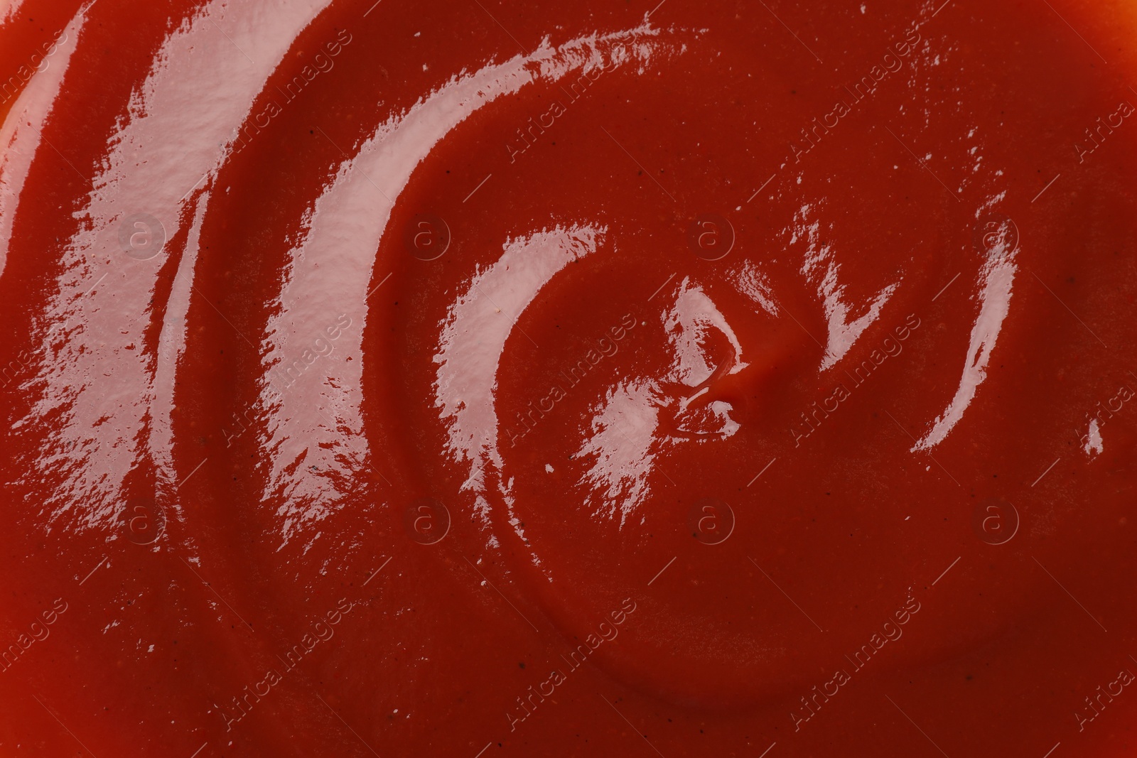 Photo of Texture of tasty ketchup as background, top view. Tomato sauce