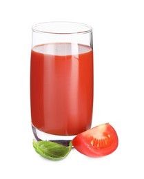 Tasty tomato juice in glass, basil leaf and fresh vegetable isolated on white