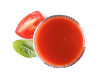 Tasty tomato juice in glass, basil leaf and fresh vegetable isolated on white, top view