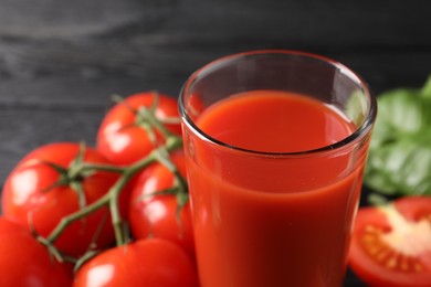 Fresh tomato juice in glass on table, closeup