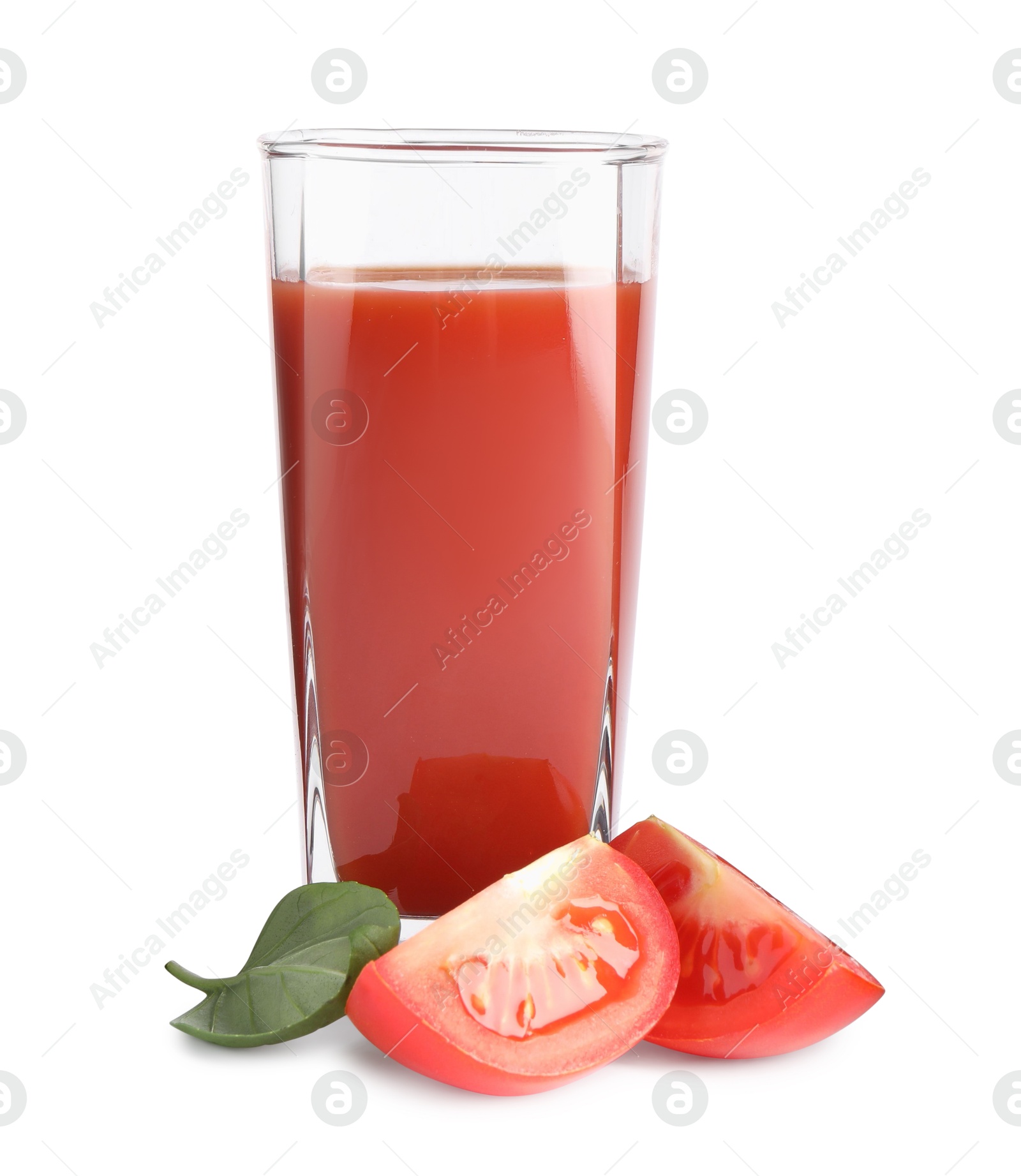 Photo of Tasty tomato juice in glass, basil and fresh vegetables isolated on white