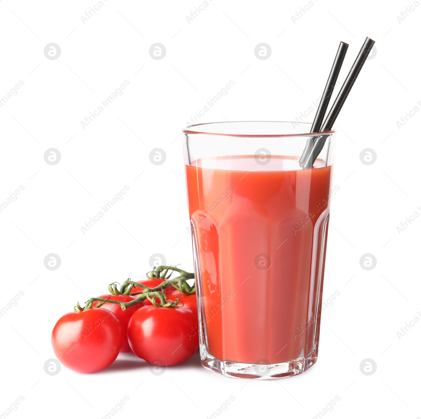 Photo of Tasty tomato juice in glass and fresh vegetables isolated on white