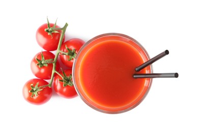 Photo of Tasty tomato juice in glass and fresh vegetables isolated on white, top view