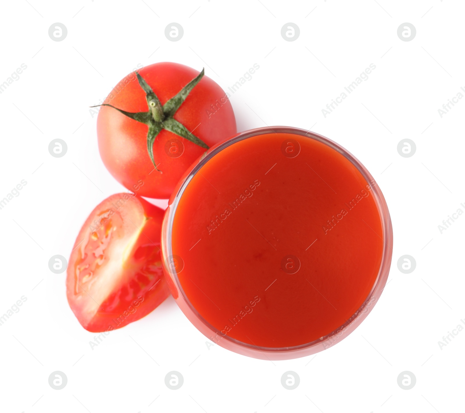 Photo of Tasty tomato juice in glass and fresh vegetables isolated on white, top view