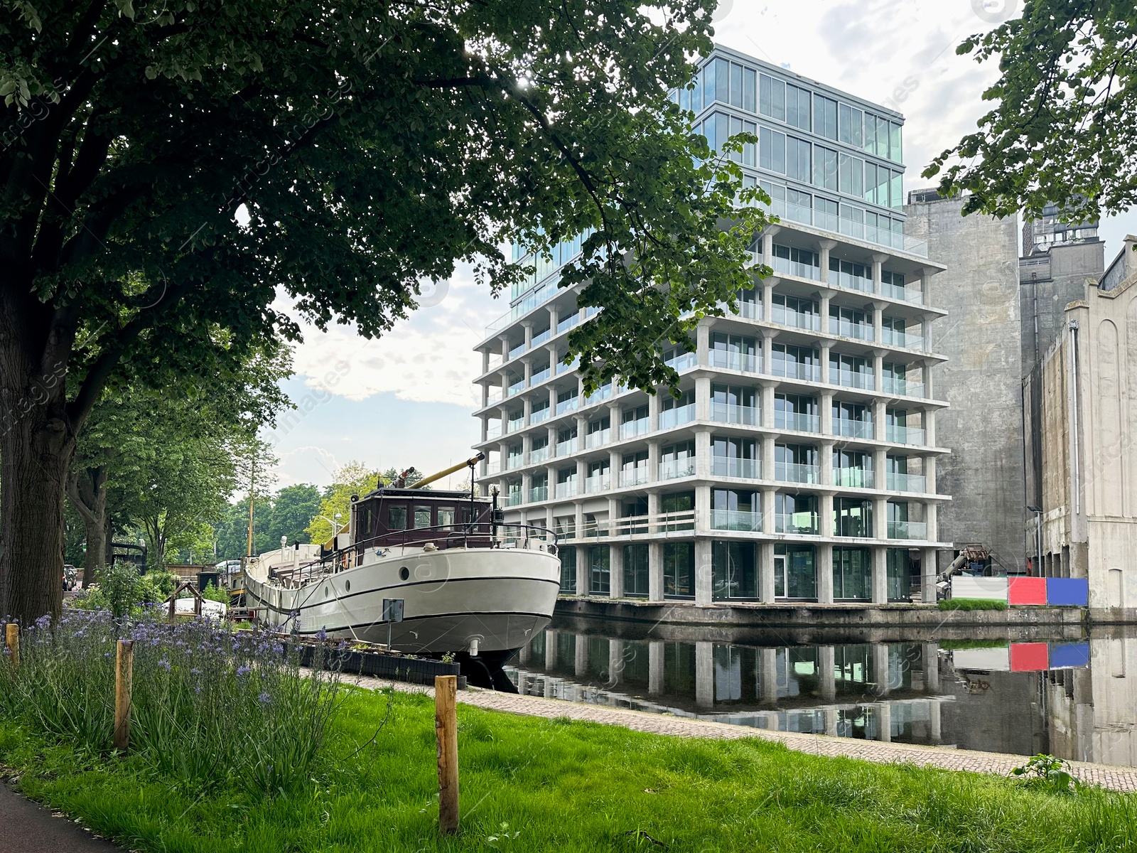 Photo of View of canal with boat in city