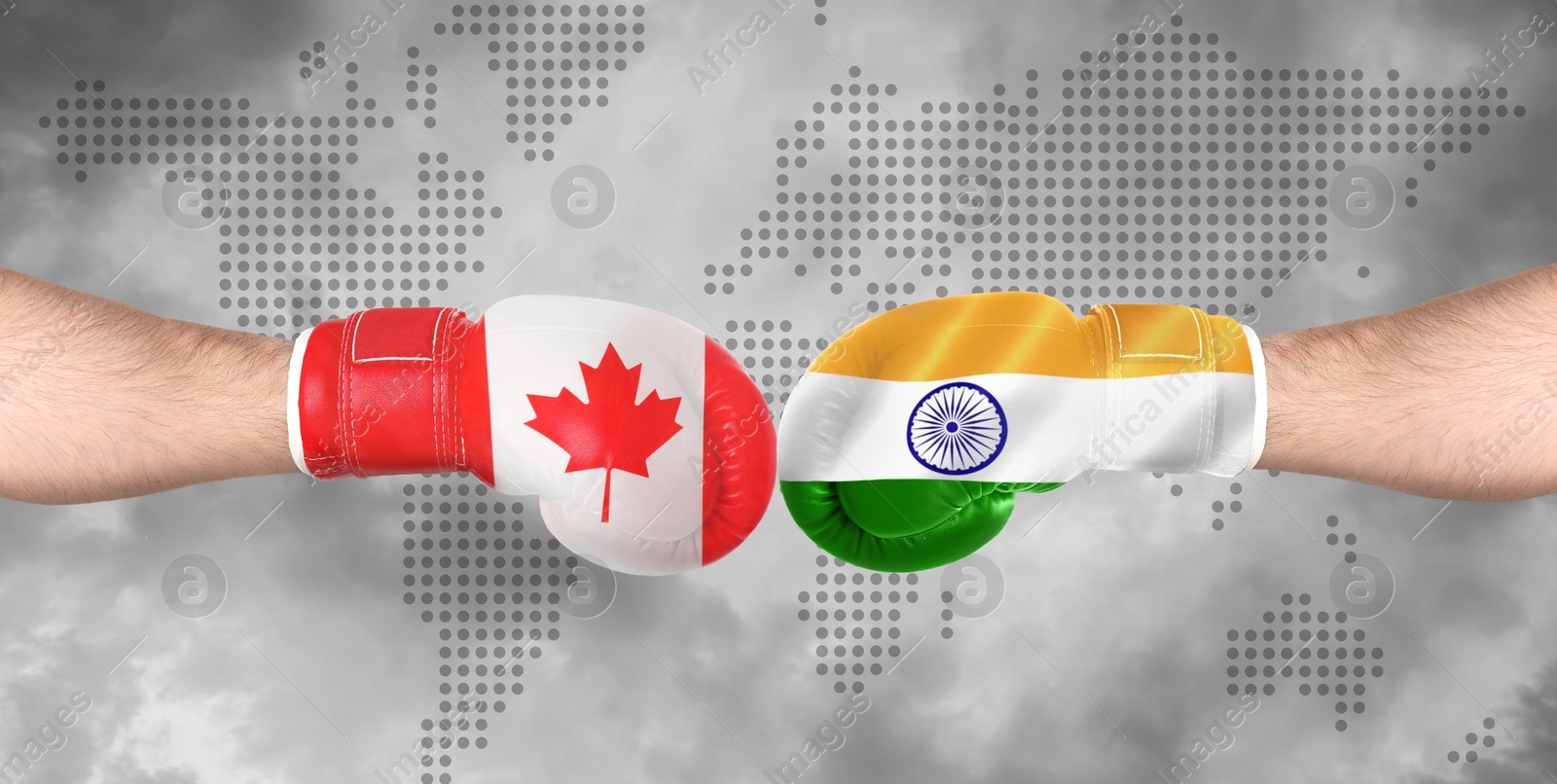 Image of Political conflict, banner design. Men in boxing gloves with flags of Canada and India fighting against world map, closeup