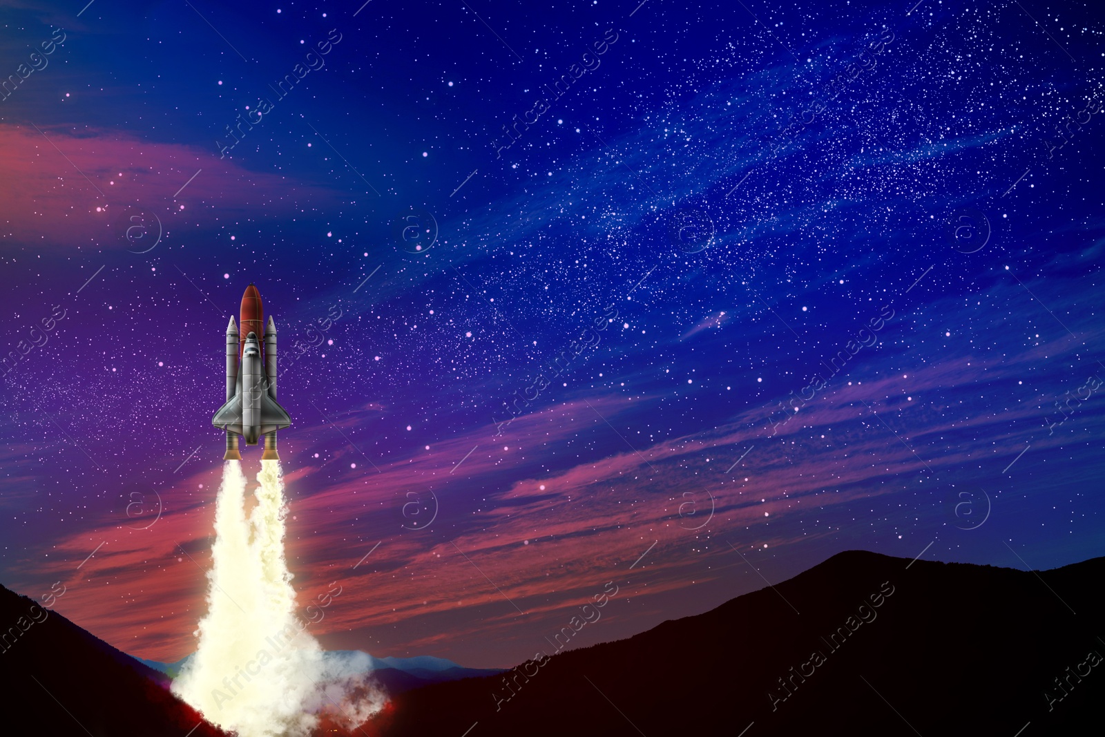Image of Launch of space rocket in mountains against starry sky at night
