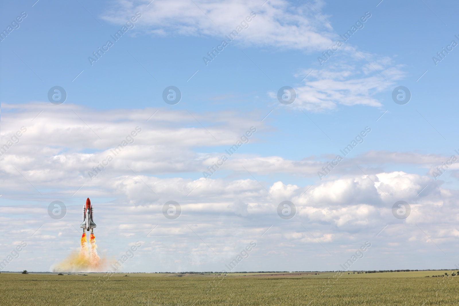 Image of Launch of space rocket in field on sunny day