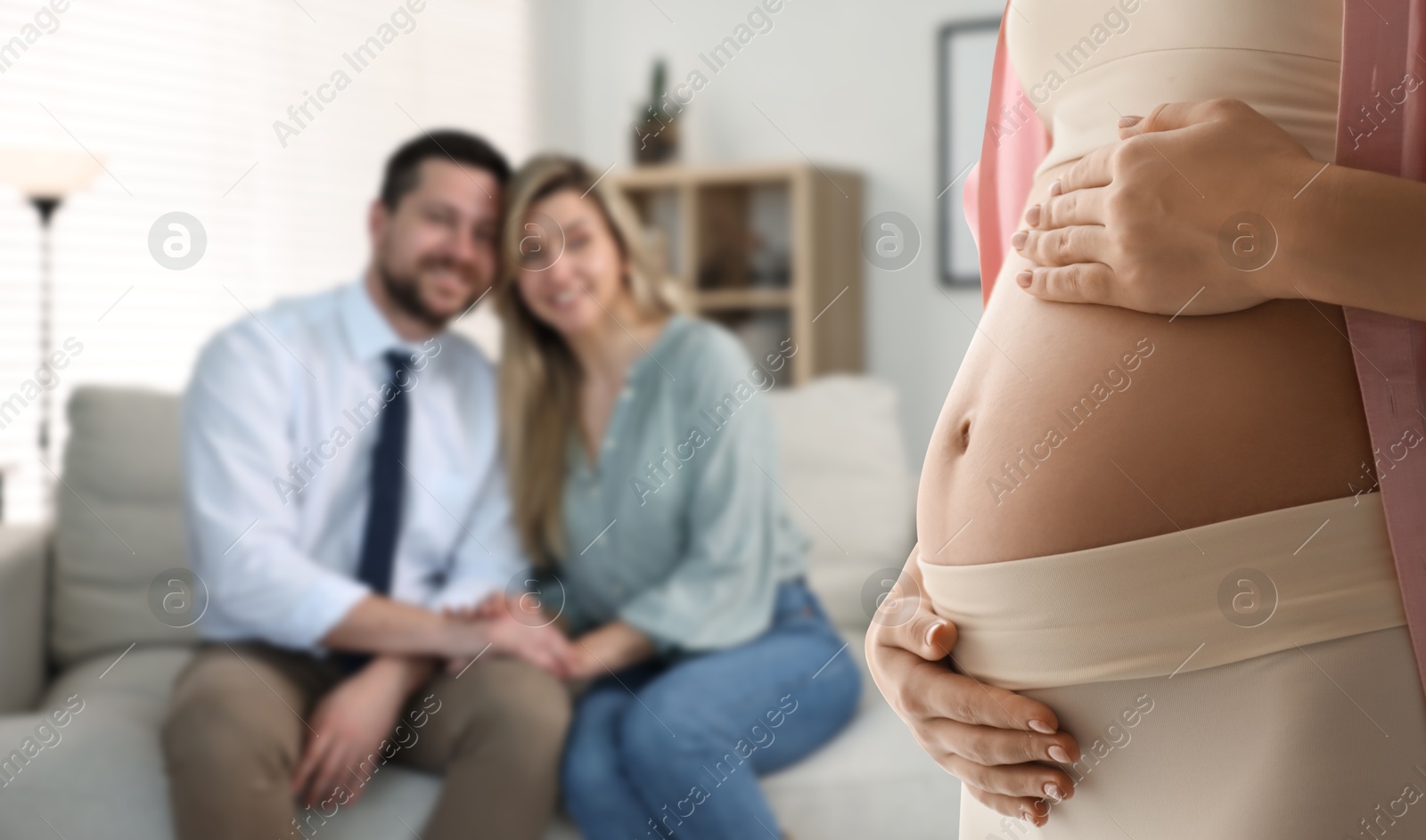 Image of Pregnant surrogate mother and happy couple at home, selective focus