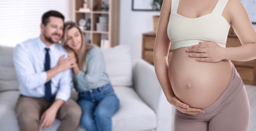 Image of Pregnant surrogate mother and happy couple at home, selective focus