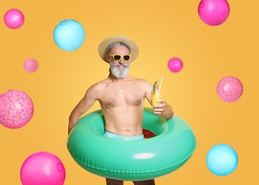 Happy man with inflatable ring among falling beach balls on orange background. Summer vibe