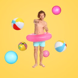 Happy man with inflatable ring among falling beach balls on golden background. Summer vibe