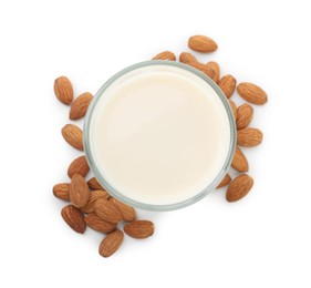 Glass of almond milk and almonds isolated on white, top view