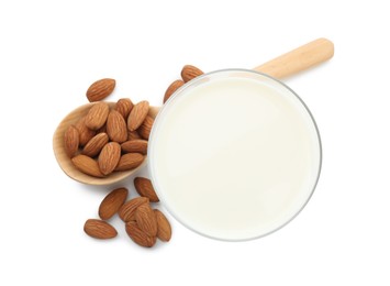 Glass of almond milk and almonds isolated on white, top view