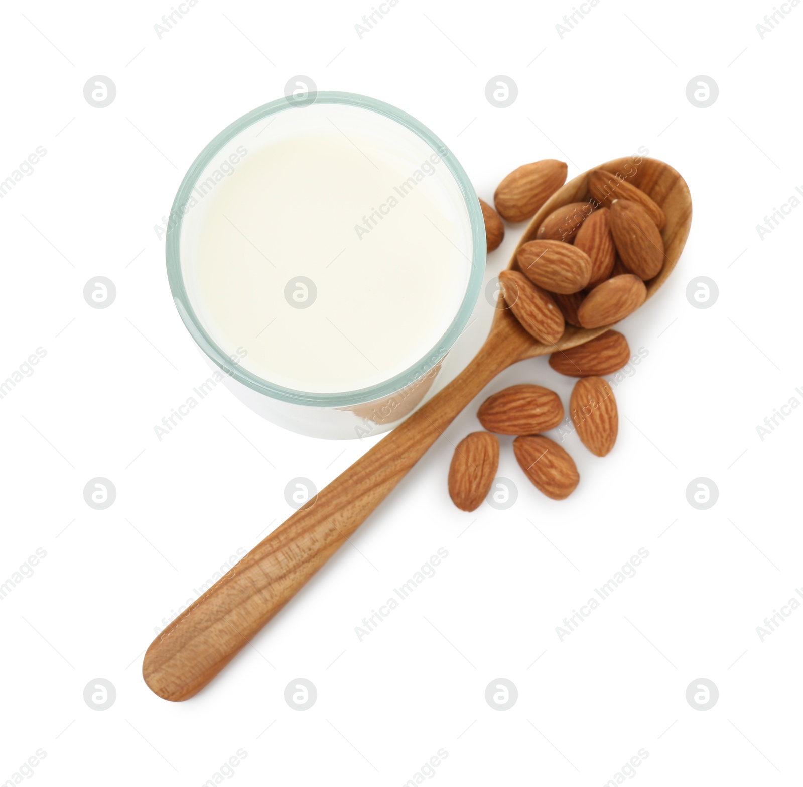 Photo of Glass of almond milk and almonds isolated on white, top view