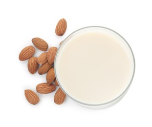 Photo of Glass of almond milk and almonds isolated on white, top view