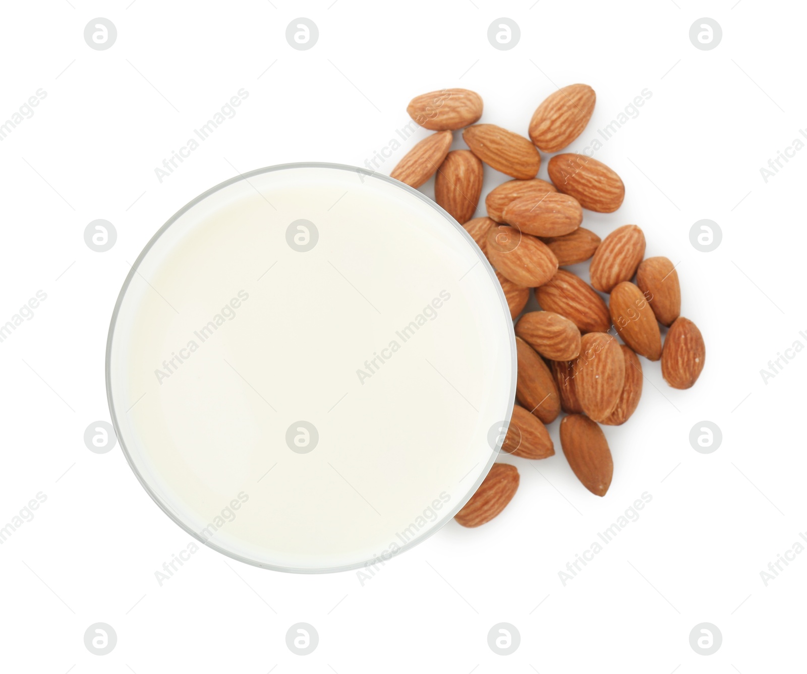 Photo of Glass of almond milk and almonds isolated on white, top view