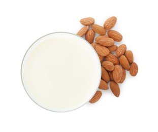 Glass of almond milk and almonds isolated on white, top view