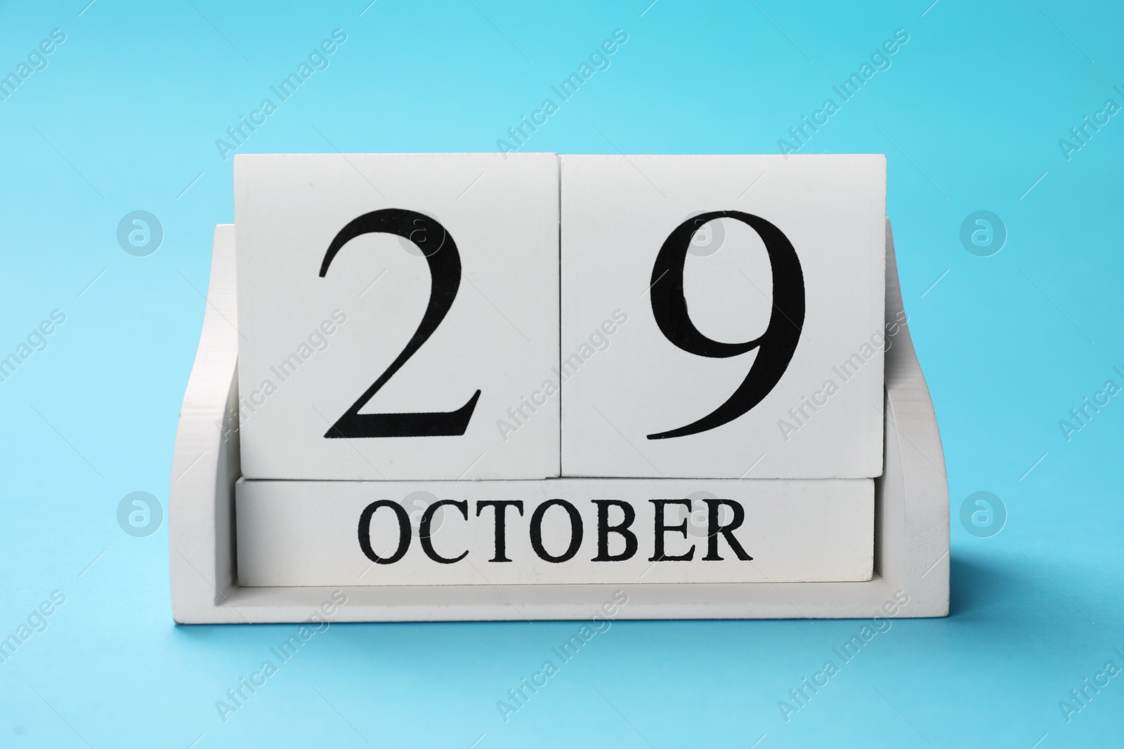 Photo of International Psoriasis Day - 29th of October. Block calendar on light blue background