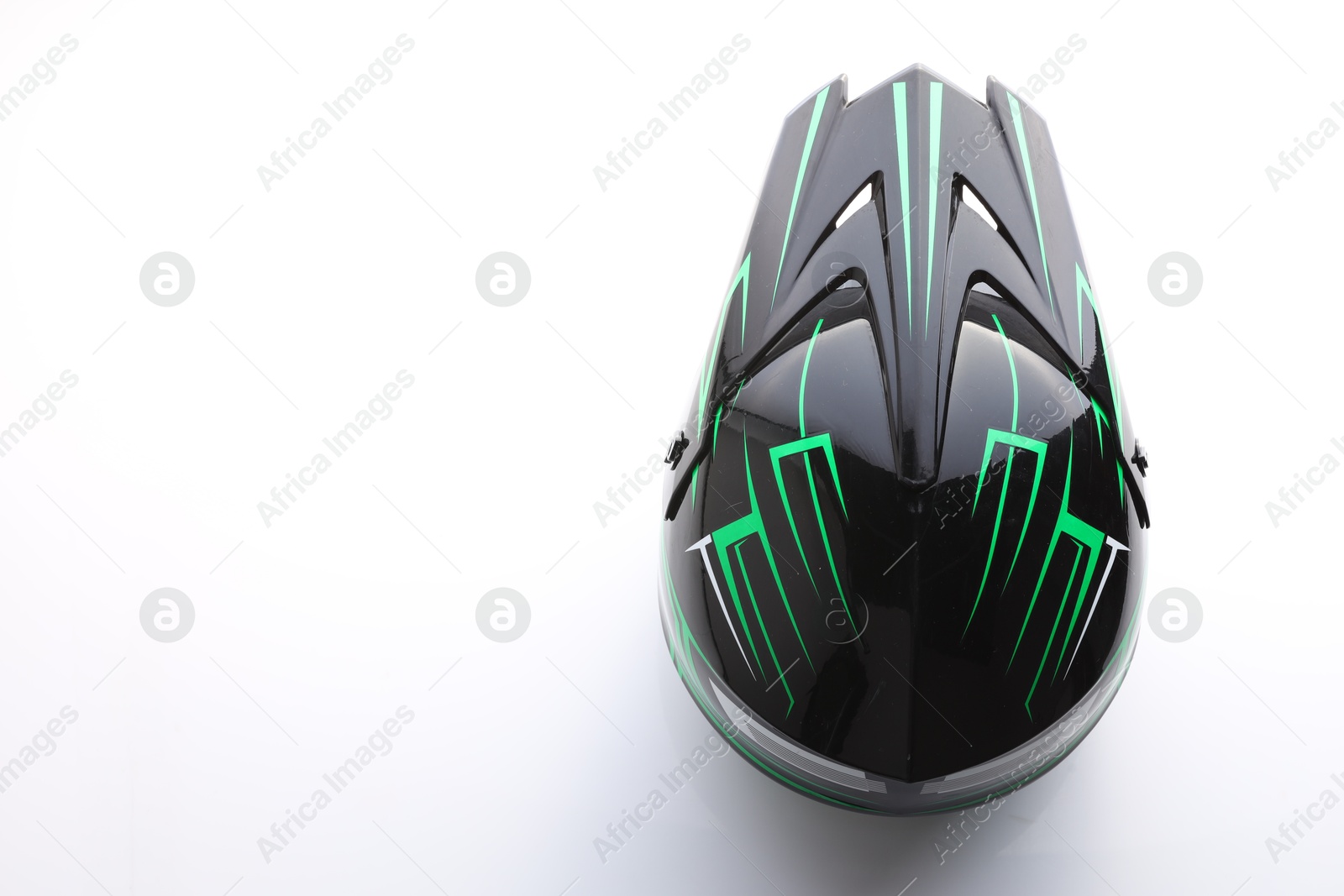 Photo of Stylish motorcycle helmet on white background, top view. Space for text