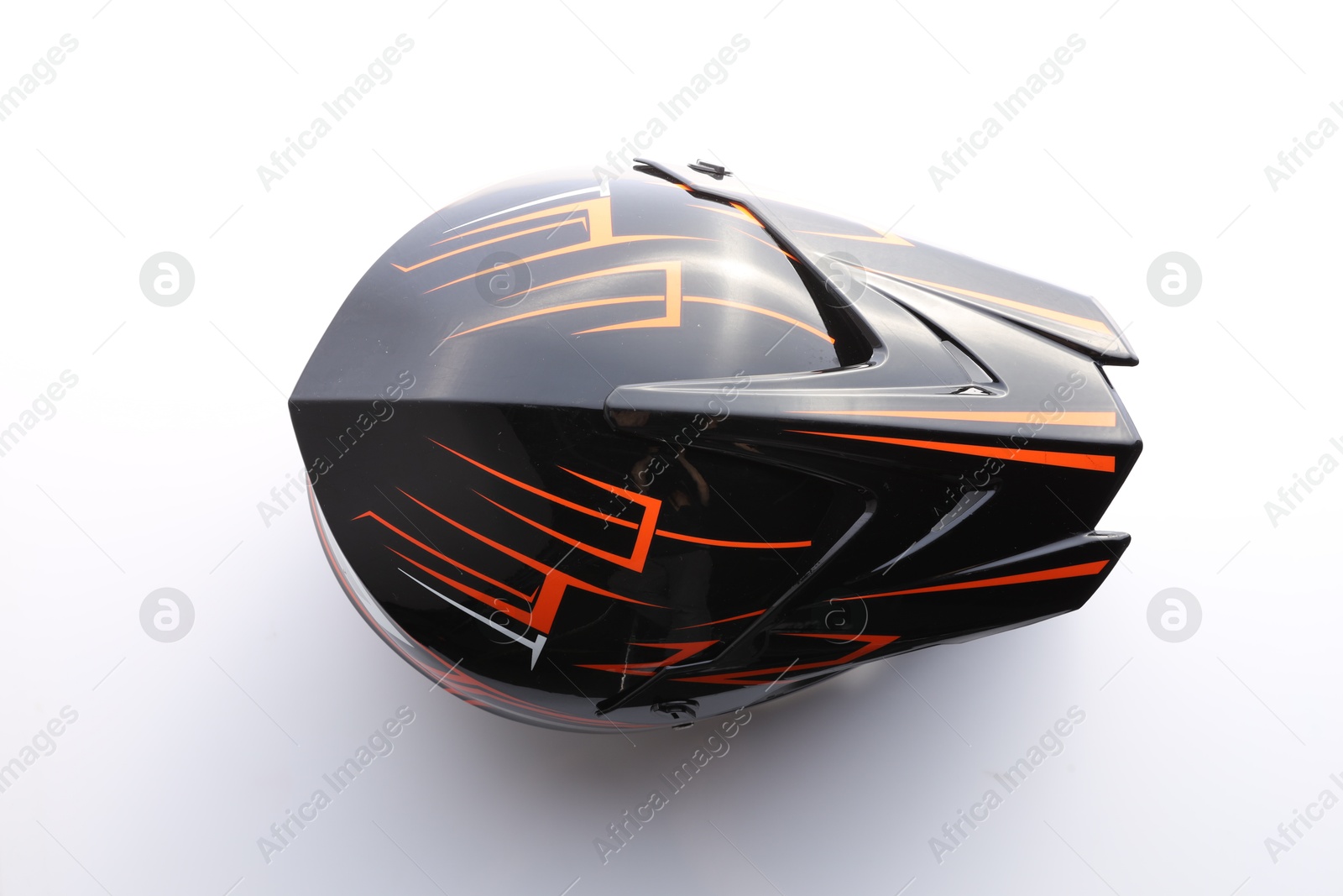 Photo of New stylish motorcycle helmet on white background, top view