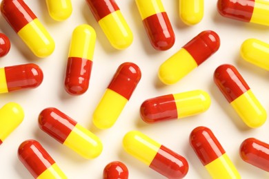 Many antibiotic pills on white background, top view