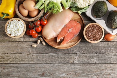 Photo of Healthy food. Different fresh products on wooden table, flat lay. Space for text