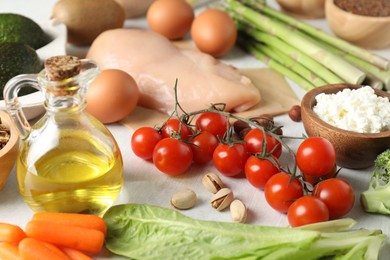 Many different healthy food on white table, closeup