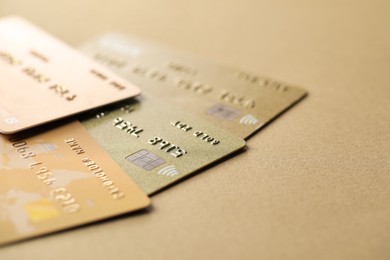 Photo of Different credit cards on table, closeup view. Space for text