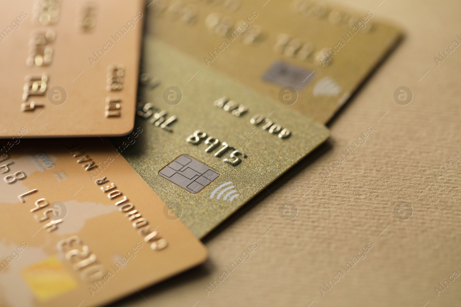 Photo of Different credit cards on table, closeup view. Space for text