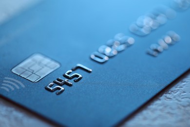 Plastic credit card on table, macro view