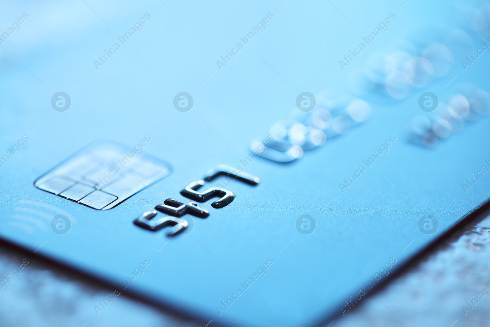 Photo of Plastic credit card on table, macro view