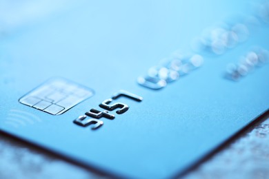 Plastic credit card on table, macro view