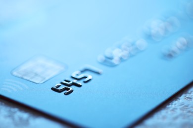 Plastic credit card on table, macro view