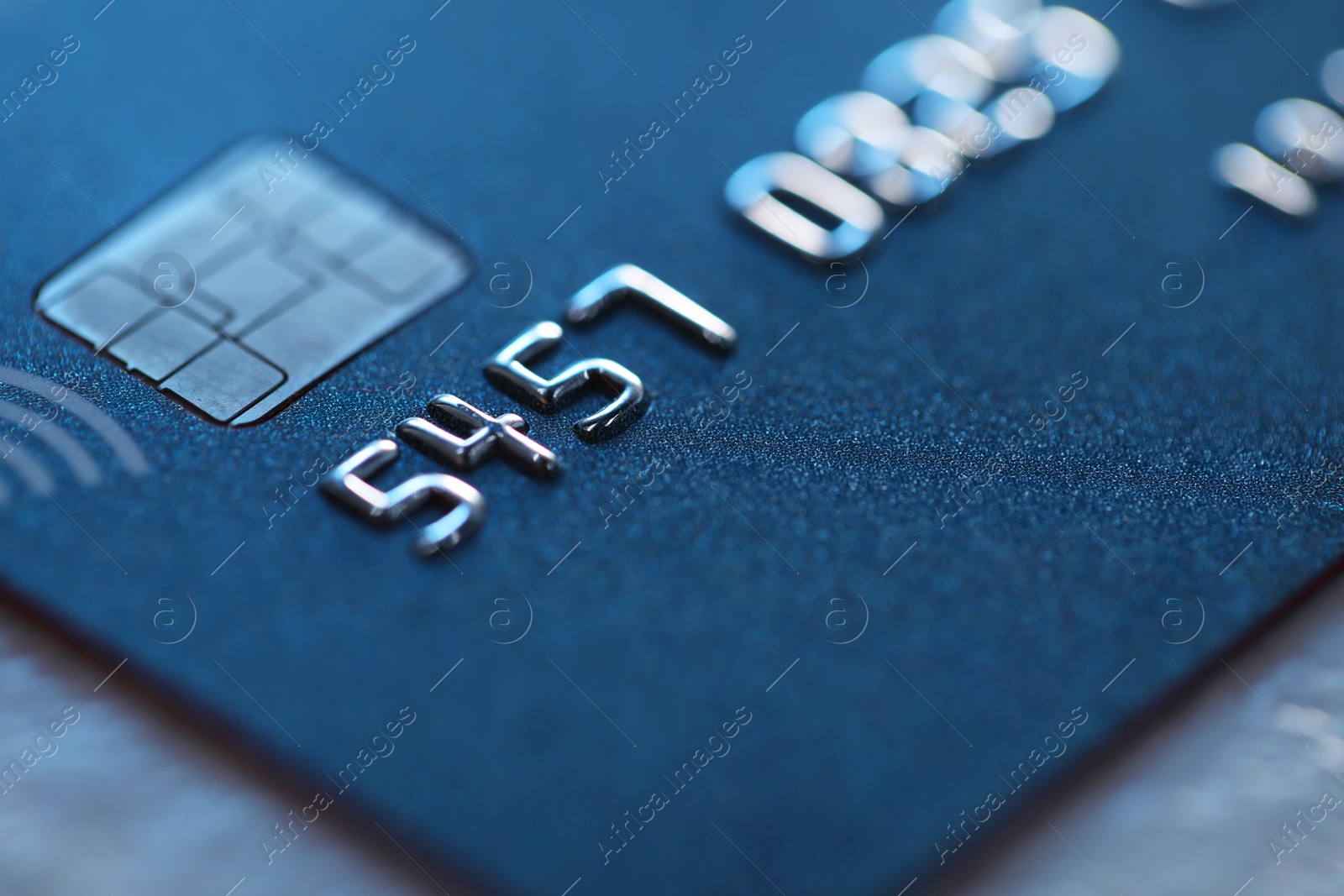 Photo of Plastic credit card on table, macro view