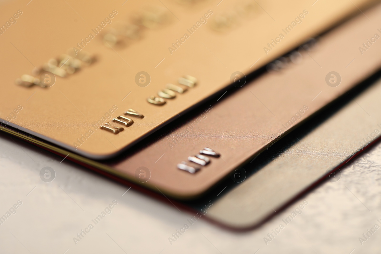 Photo of Many credit cards on gray background, closeup