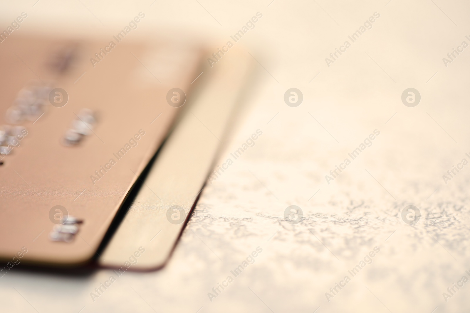 Photo of Two credit cards on gray background, closeup. Space for text