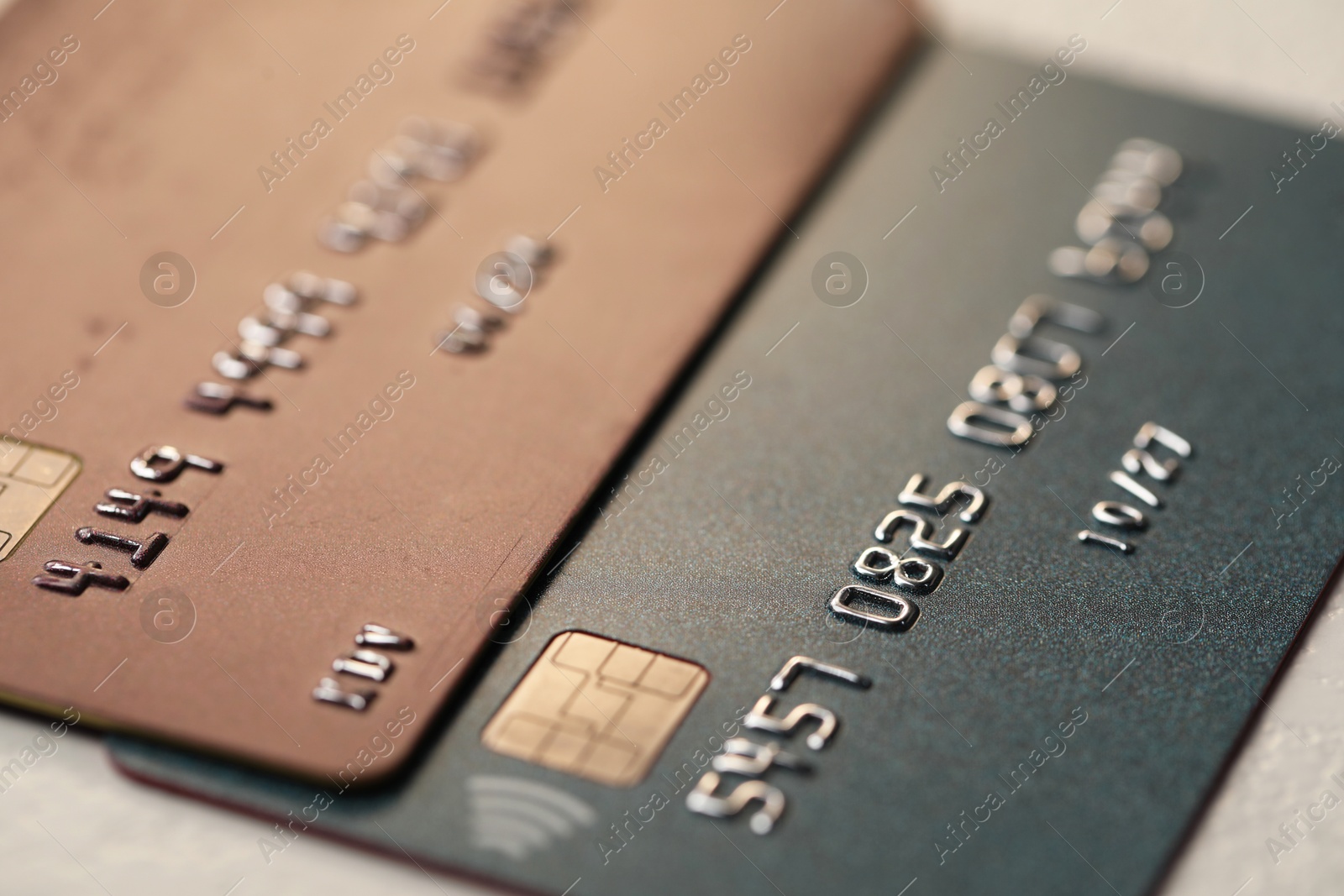 Photo of Two credit cards on table, closeup view