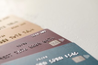 Many credit cards on gray background, closeup