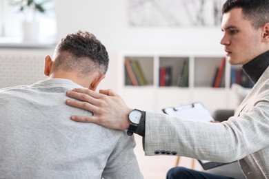 Professional psychotherapist working with patient in office