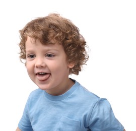 Portrait of cute little boy showing tongue on white background