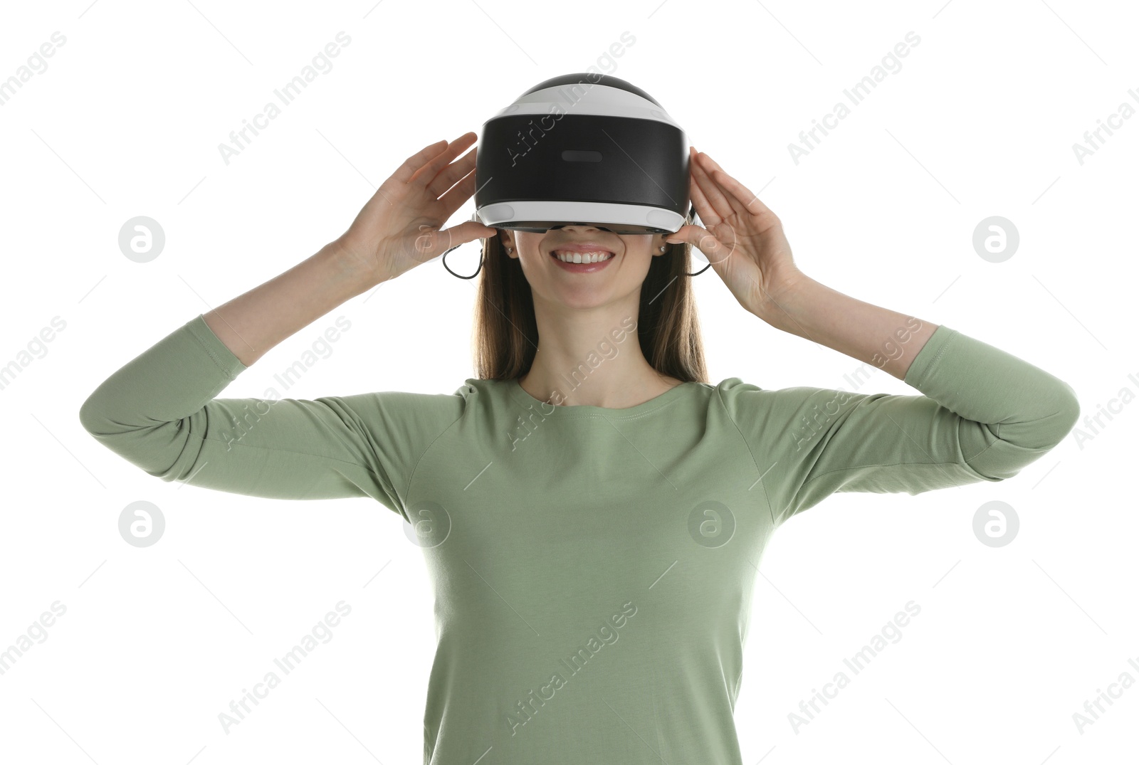 Photo of Smiling woman using virtual reality headset on white background