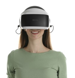 Photo of Smiling woman using virtual reality headset on white background