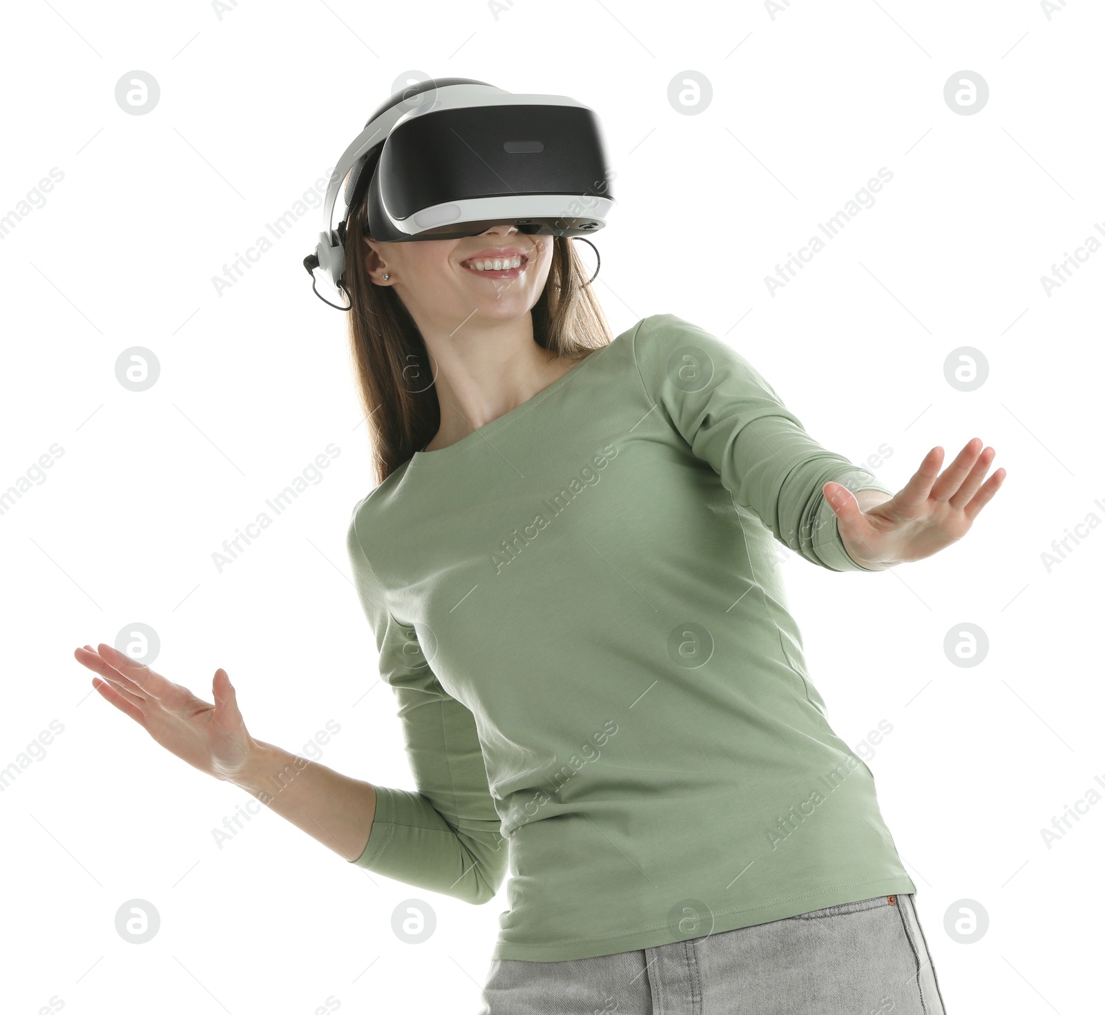 Photo of Smiling woman using virtual reality headset on white background