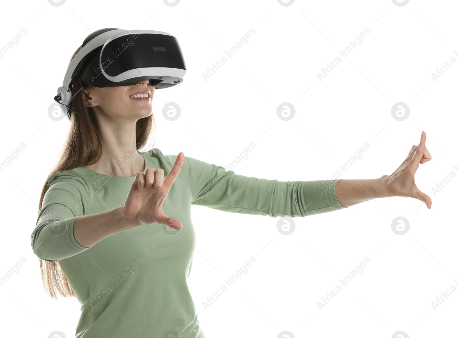 Photo of Smiling woman using virtual reality headset on white background