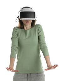 Photo of Surprised woman using virtual reality headset on white background