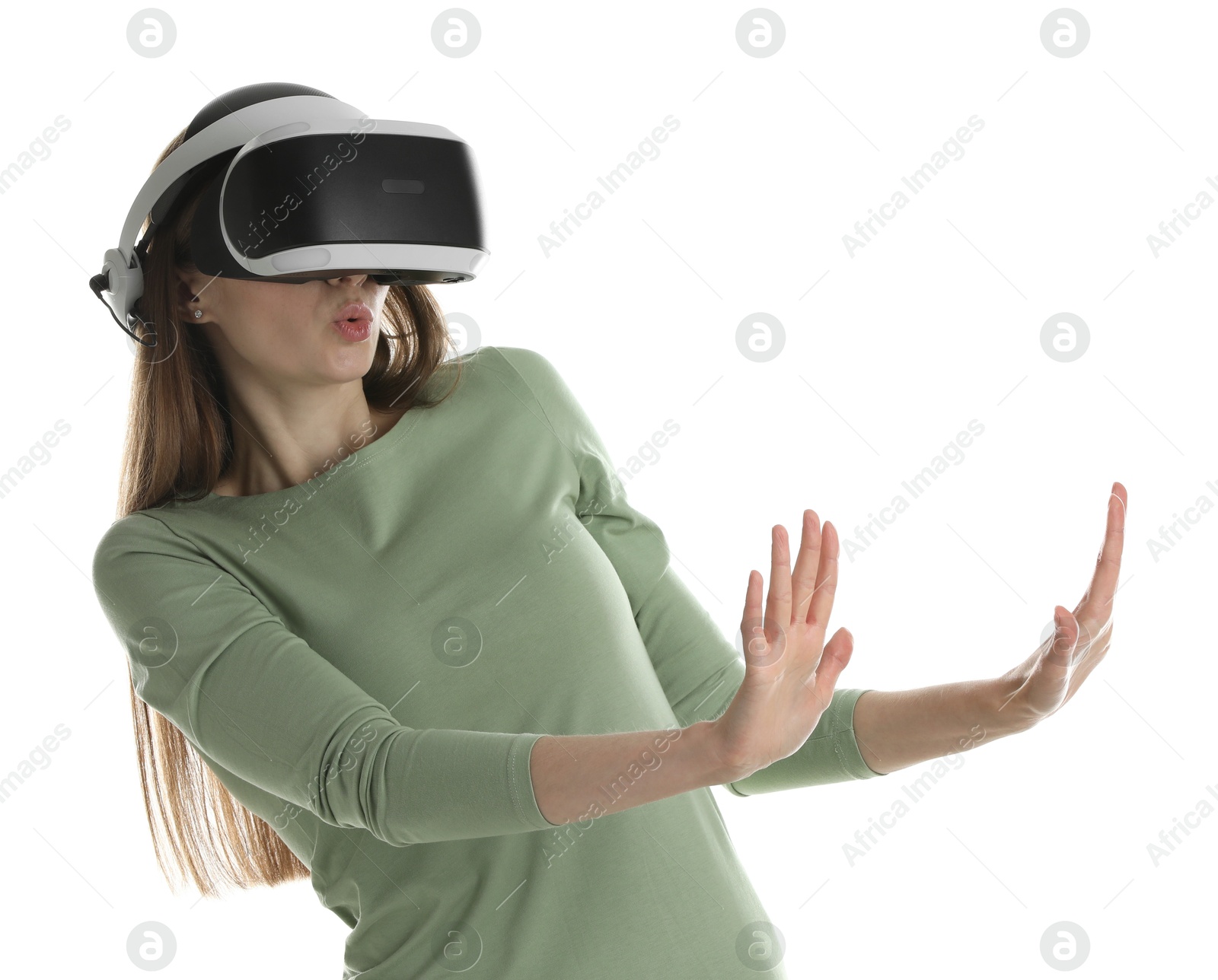 Photo of Surprised woman using virtual reality headset on white background